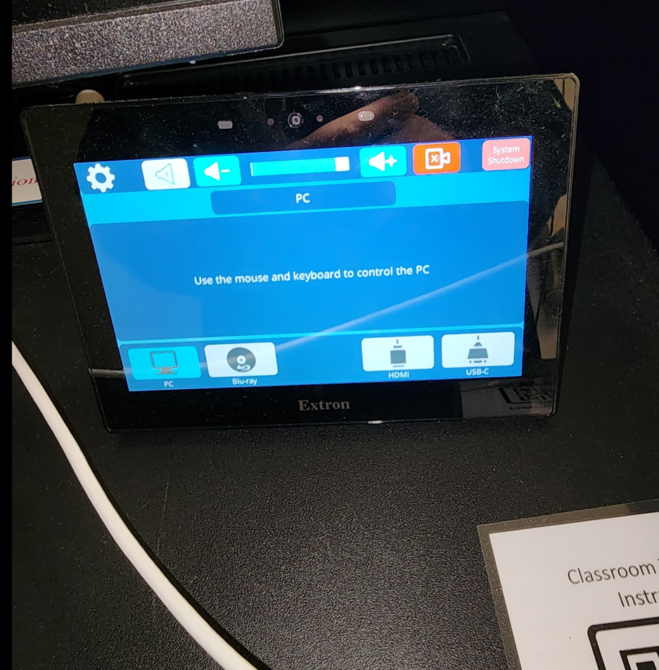 A small rectangular device with a blue screen

Description automatically generated